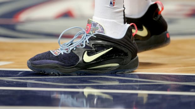 Black, yellow, and blue Nike KD shoes.